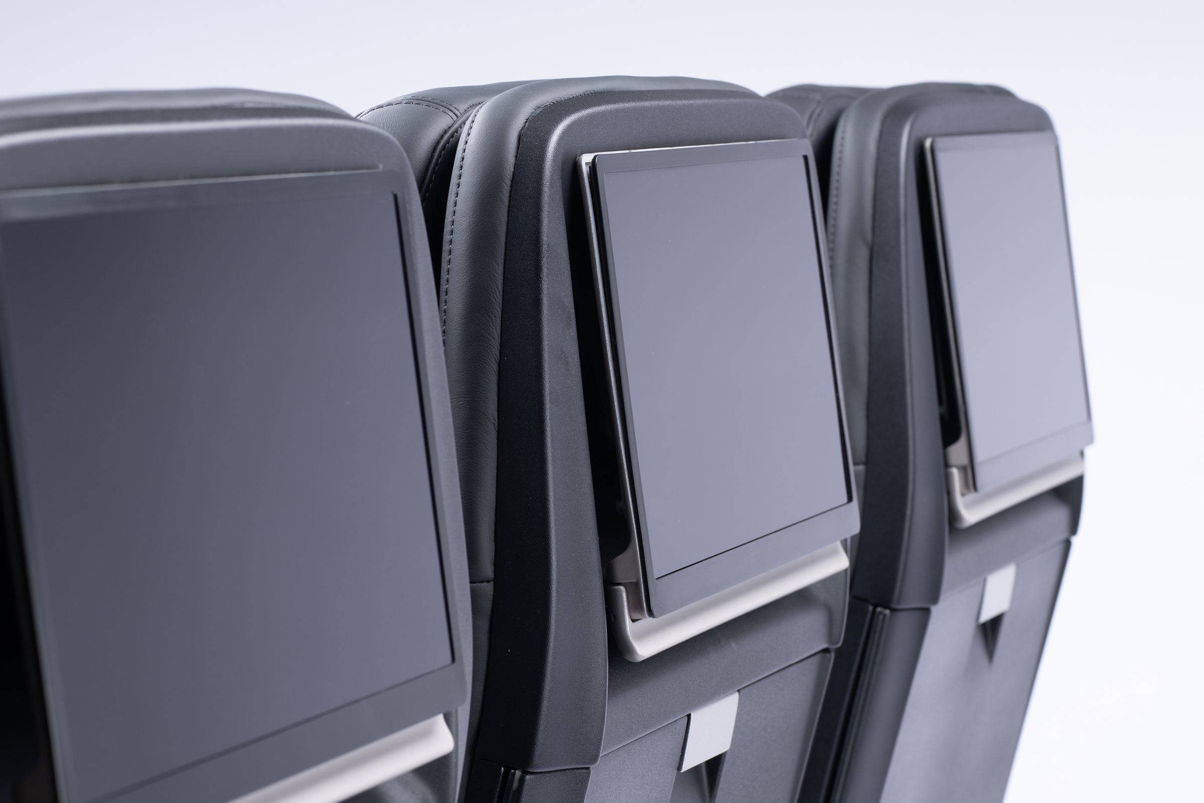 Falcon aircraft seat by Mirus Aircraft Seating showing 13 inch IFE Inflight Entertainment screens