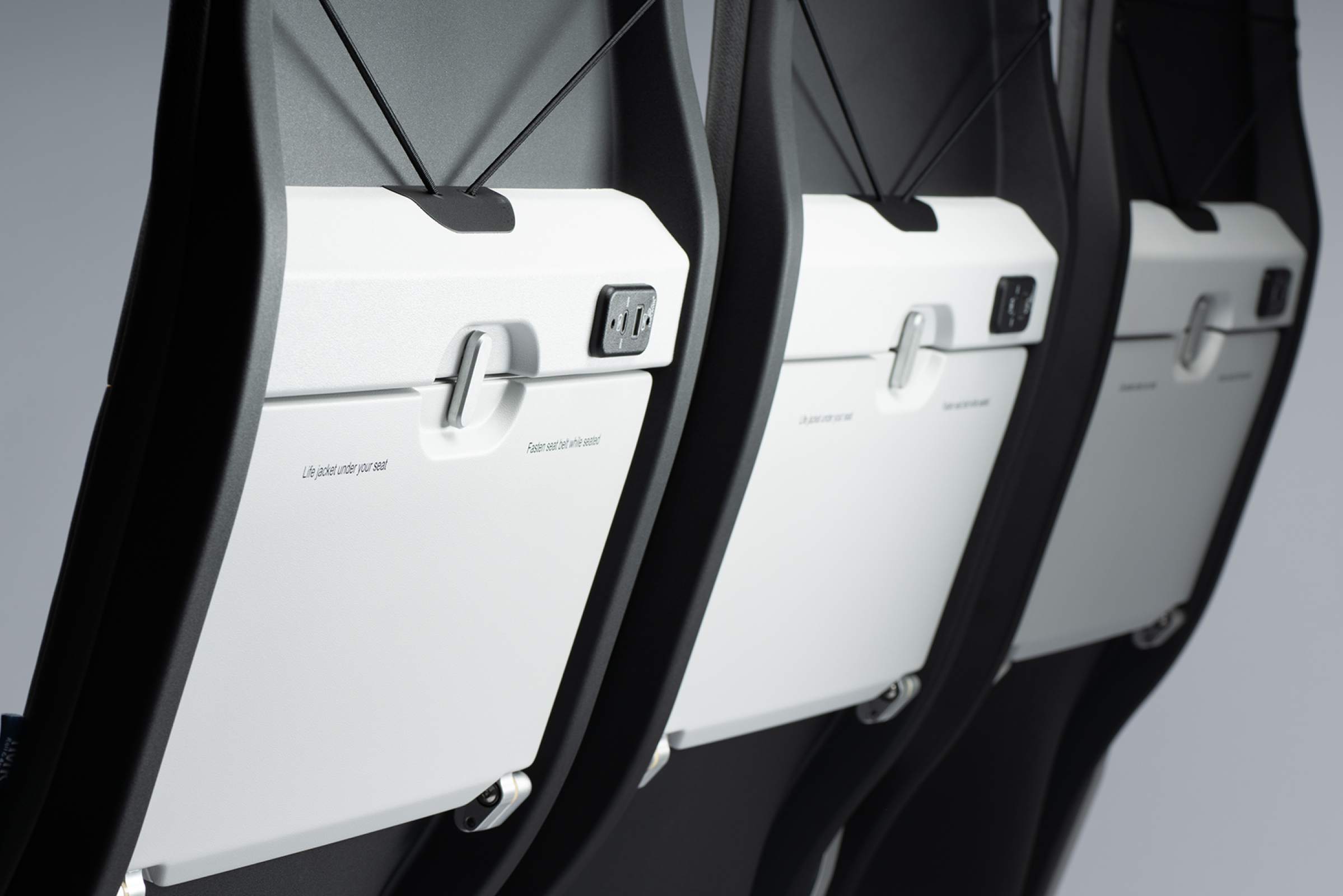 Kestrel aircraft seat back tray and upper lit pocket by Mirus aircraft seating