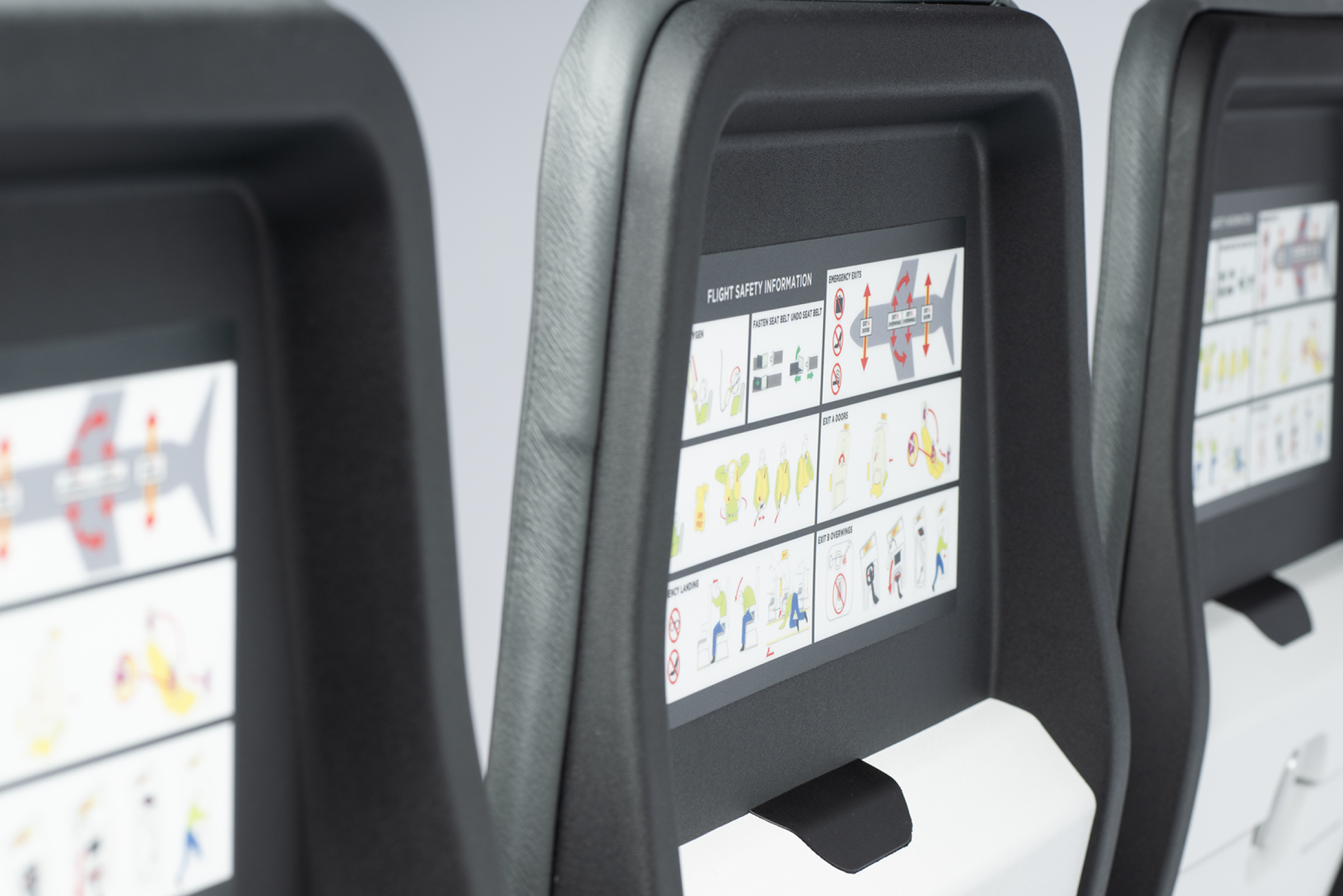 Kestrel aircraft seat with safety placards by tray by Mirus Aircraft Seating