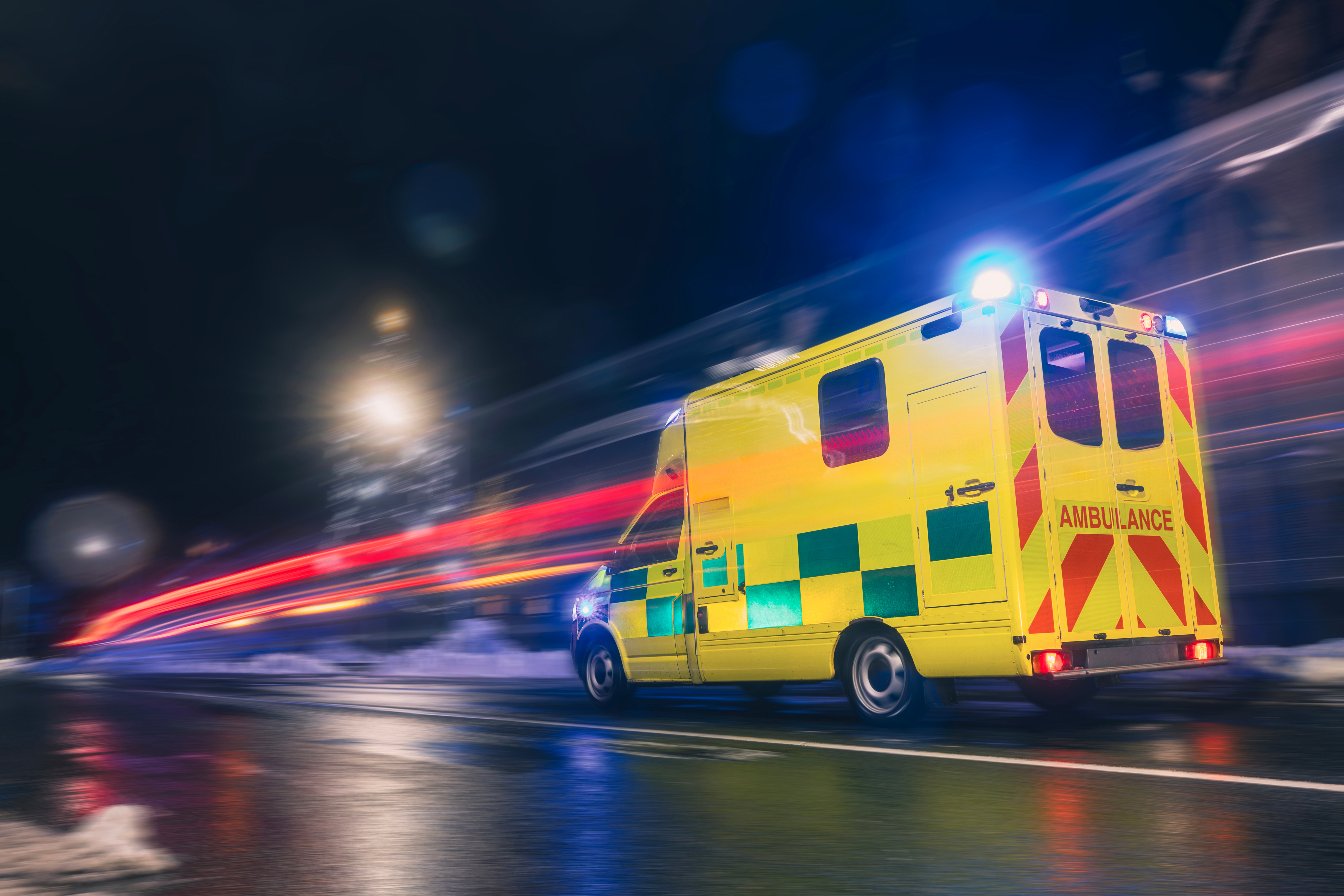 Ambulance at night with flashing lights